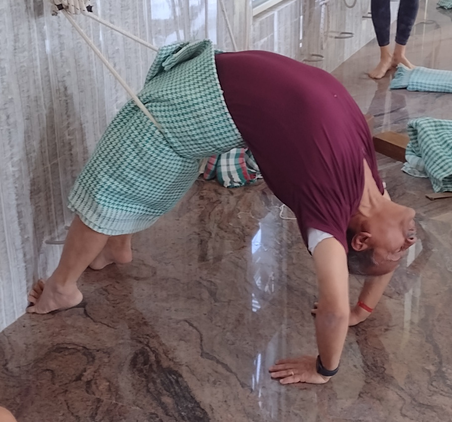 Arun-ji using the wall hooks for a back bend